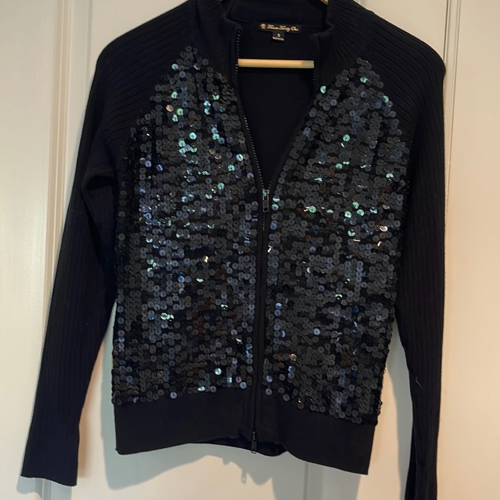 Sweater jacket with chest sequence.
